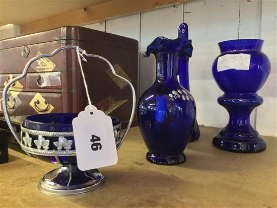 4 blue glass items: 2 vases, a jug and a sugar basin